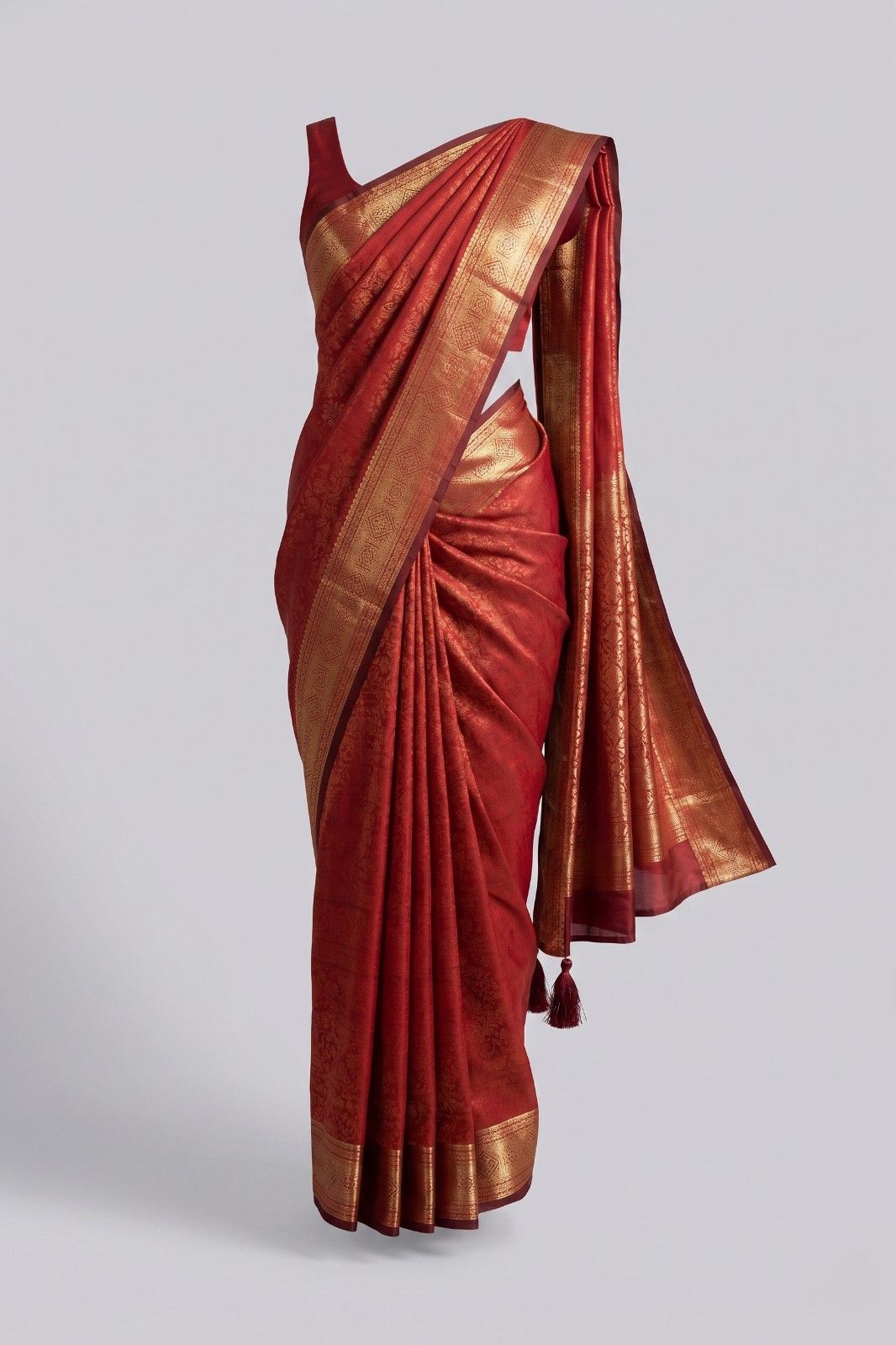 Red Kanjivaram silk saree for women with elegant golden woven border