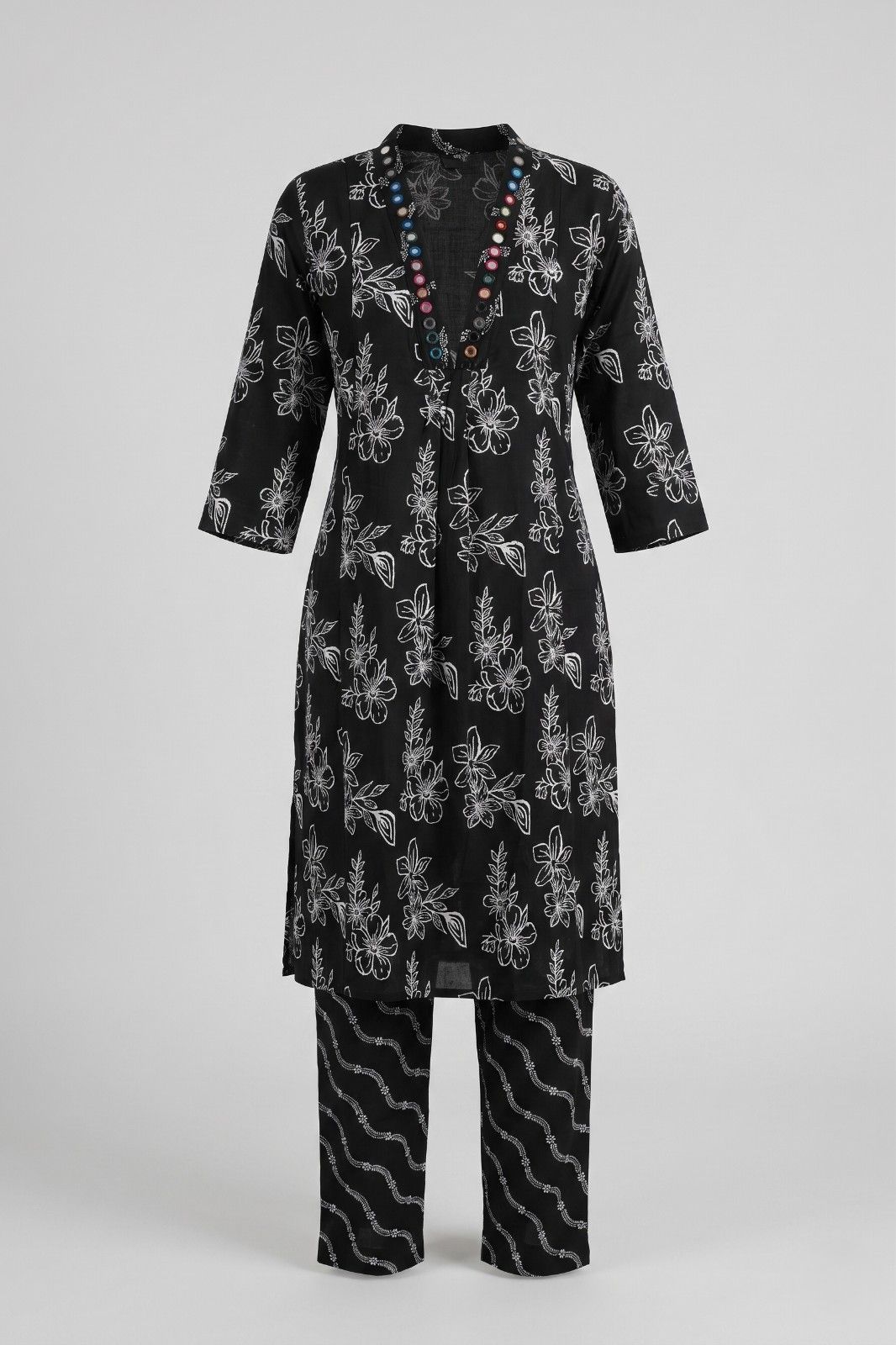 Women’s black floral printed A-line kurta with palazzo pants and decorative neckline